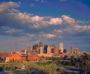 The REI Denver flagship is visible in the foreground of downtown Denver in this photograph. - Photo Credit: Robert Pisano