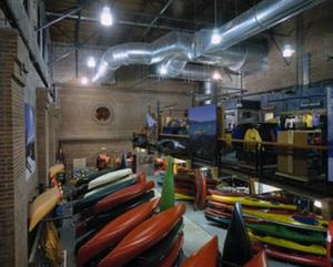 The original structure of the renovated building is visible behind the canoes and other merchandise in this photo. - Photo Credit: Robert Pisano