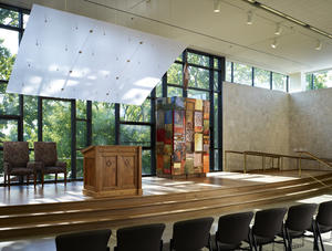 In this photo of the sanctuary are the bimah, ark, and sound baffle. - Photo Credit: Steve Hall, Hedrich Blessing