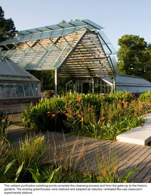 This photograph shows wetlands, which serve to purify water, and greenhouses used as classrooms and experimental stations. - Photo Credit: Hester + Hardaway Photography