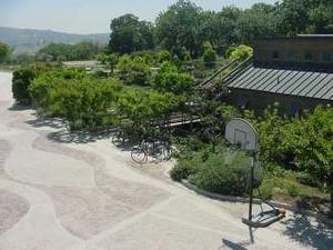 This photo illustrates the hilly nature of the surrounding landscape. Shown here is a recreational space. - Photo Credit: Juan Araya, CRS Site Technician