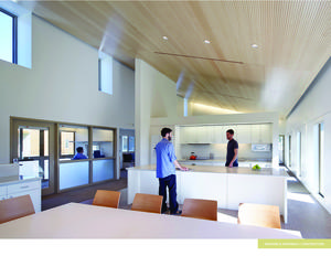 Typical residence living area with balanced daylight, operable windows, and acoustic ceiling with sustainably harvested wood panels. - Photo Credit: Tim Griffith