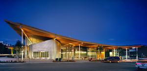 The building is lit dramatically in this photo taken from 22nd Avenue Northwest. - Photo Credit: Nic Lehoux