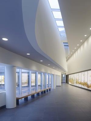 This photo of the third-floor public corridor highlights the building's abundant daylighting. - Photo Credit: Tim Griffith
