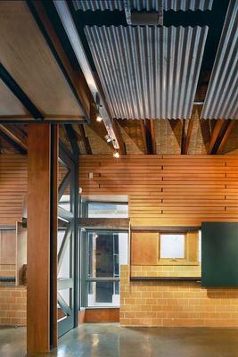 This photo of a multipurpose wall shows reused, recycled, and sustainable finishes. - Photo Credit: Nic Lehoux