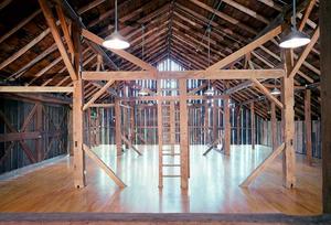 This photo shows the barn's upper assembly space. - Photo Credit: Nic Lehoux