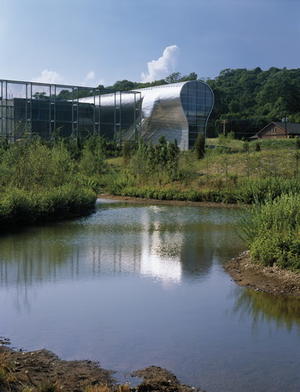 This photo shows the trellis and pond with the main building beyond. - Photo Credit: © Paul Warchol