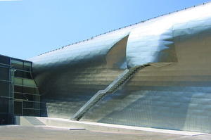 This photo highlights the building's stainless steel shingles. - Photo Credit: © Steven Holl Architects