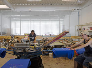 The translucent partitions shown in this photograph let light penetrate deep into the interior. - Photo Credit: Richard Mandelkorn