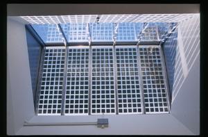 Glass-laminated PV cells are visible through the skylight in this photograph. - Photo Credit: David Bushnell