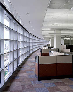 This photo shows open office space along the south curtainwall. - Photo Credit: Massery Photography, Inc.--L.D. Astorino Companies