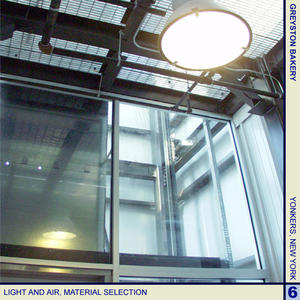 Efficient metal-halide lamps, such as the one in this photograph, were used throughout the Bakery, reducing the energy required to light spaces. Numerous exterior windows were also strategically located to further allow natural light into the interior of the Bakery. - Photo Credit: Cybul and Cybul Architects