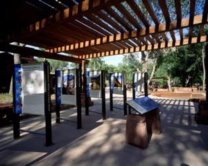 Outdoor "rooms" for permanent displays allow for a smaller building design as well as lower capital and operation costs. - Photo Credit: Robb Williamson