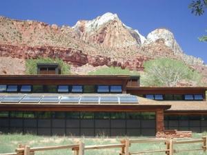 This photo shows the southern exposure of the Visitor Center, a well-suited location for Trombe walls that provide most of the building's heat as well as a 7.2 kW PV array. - Photo Credit: Thomas Wood