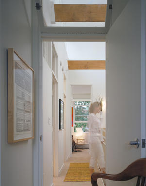 Second floor carpeting, visible in this photo, is made from recycled plastic bottles. Due to the placement of utilities and equipment in the basement, an open, unencumbered layout is achieved on floors one and two. - Photo Credit: Doug Snower Photography